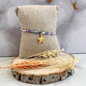Boutique de bijoux à Toulouse : Bracelet réglable violet avec une étoile en acier inoxydable doré suspendue