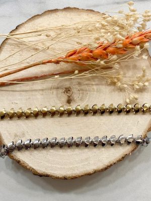 Boutique de bijoux à Toulouse : 2 bracelets épais en acier inoxydable doré et argenté avec des motifs en forme de vagues