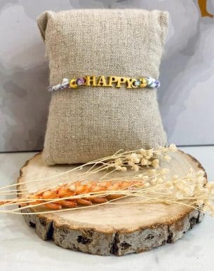 Boutique de bijoux à Toulouse : Bracelet réglable violet avec des lettres en acier inoxydable doré