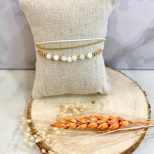 Boutique de bijoux à Toulouse : bracelet multi rang en acier inoxydable doré avec des perles blanches