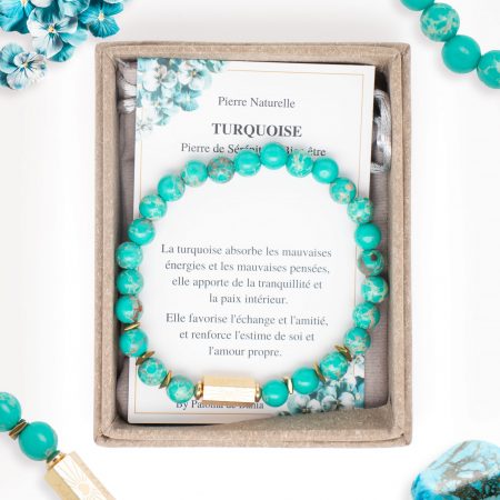 Bracelet Caixa en pierres naturelles turquoise et en acier inoxydable doré dans son emballage